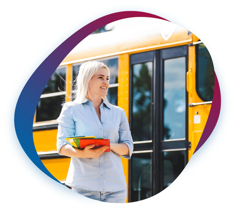 A school-based clinician stepping off a school bus with an armful of books