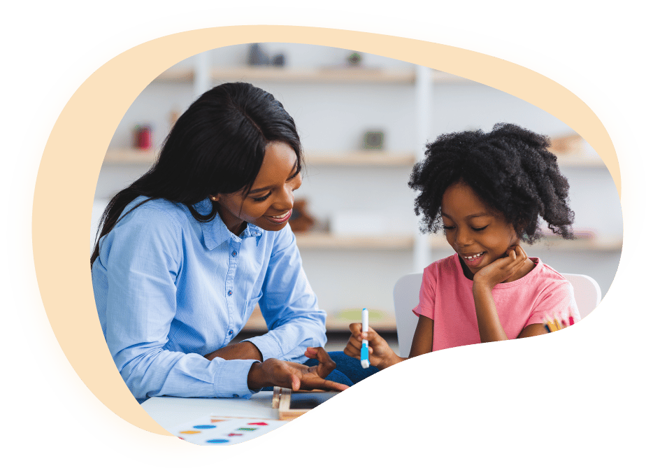 A school therapist working one to one with a young student