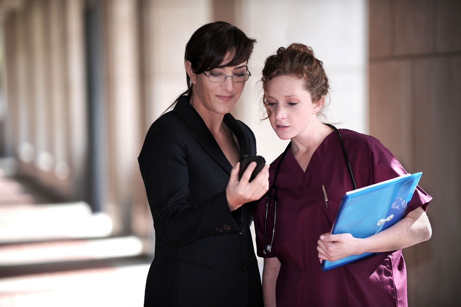 Healthcare professionals reviewing information together