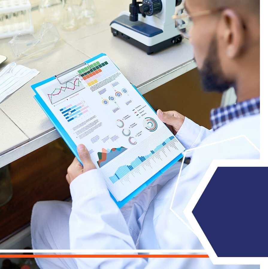 A scientist reviewing safety data charts on a clipboard
