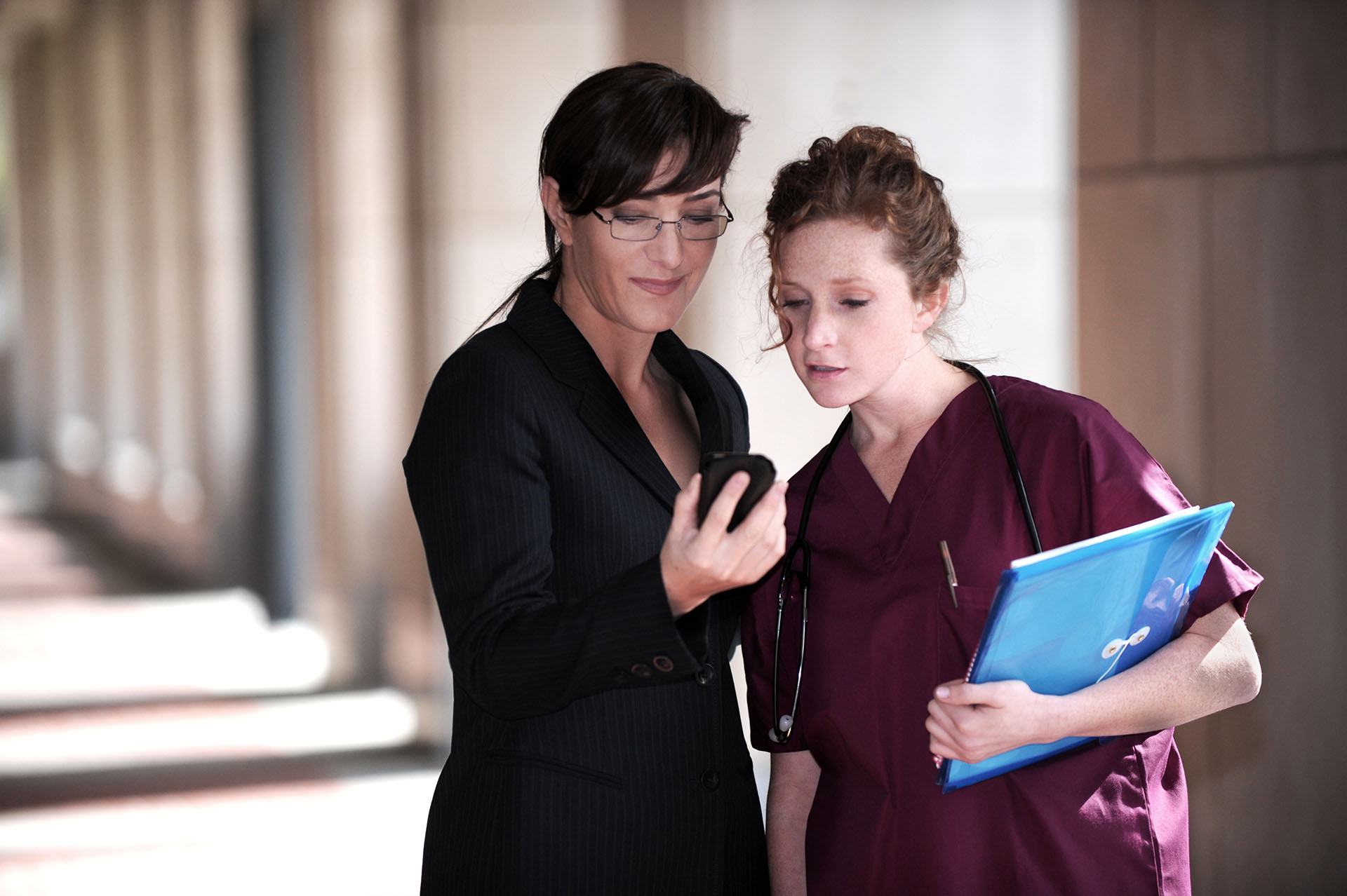Healthcare professionals reviewing information together